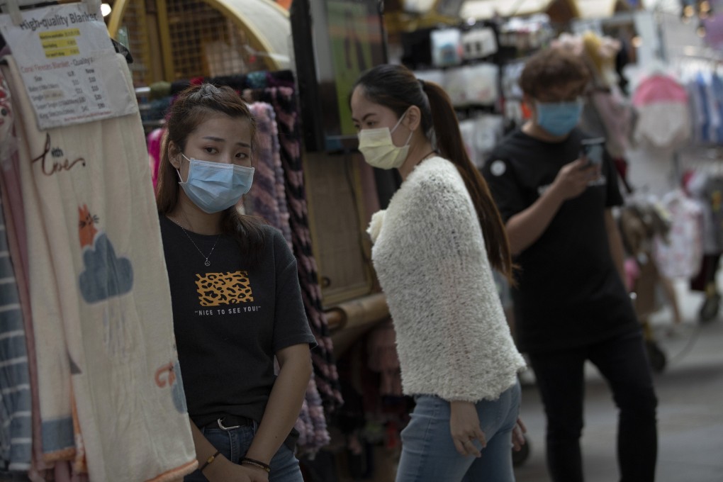 Shopping assistants at the Bugis Junction mall in Singapore. Photo: EPA