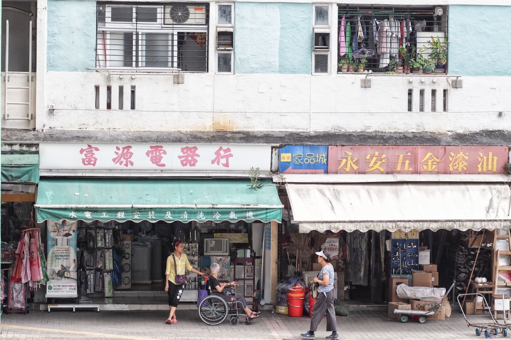 Domestic helper assisting the elderly in their wheelchairs is a common sight in neighbourhoods with many senior citizens. Photo: Manami Okazaki