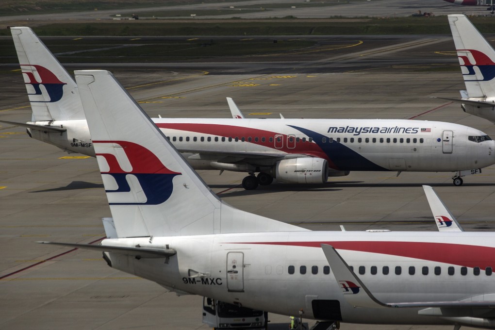 Malaysia Airlines aircraft are seen from the viewing gallery at the Kuala Lumpur International Airport. Photo: EPA-EFE
