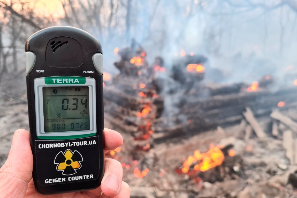 A Geiger counter measures the radiation level at the site of the fire in the exclusion zone around the Chernobyl nuclear power plant, outside the village of Rahivka, Ukraine. Photo: Reuters