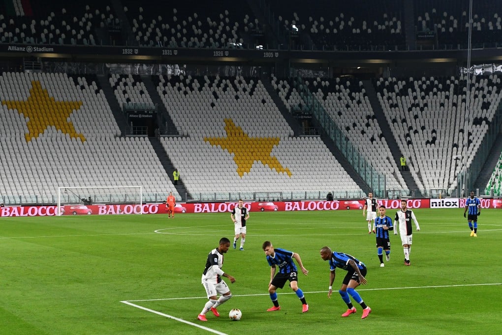 Juventus’ Brazilian forward Douglas Costa (left) vies with Inter Milan’s Italian midfielder Nicolo Barella during a Serie A match played out in an empty stadium. Photo: Vincenzo Pinto/AFP via Getty Images