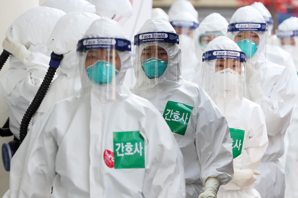 Nurses wearing protective suits line up to enter a treatment ward for Covid-19 patients in Daegu, South Korea. East Asia has received global acclaim for its success in fighting the coronavirus pandemic. Photo: DPA