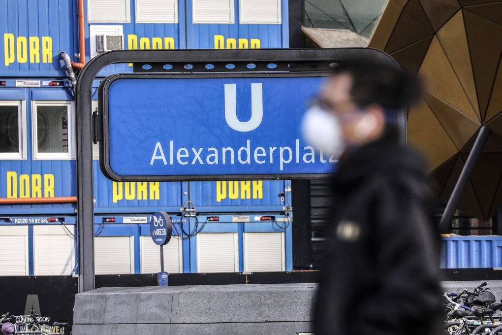 A man wearing a protective face mask passes by the railway station at Alexanderplatz in Berlin, Germany, on April 3. The German government and local authorities are increasing measures to stem the spread of the coronavirus. Photo: EPA-EFE