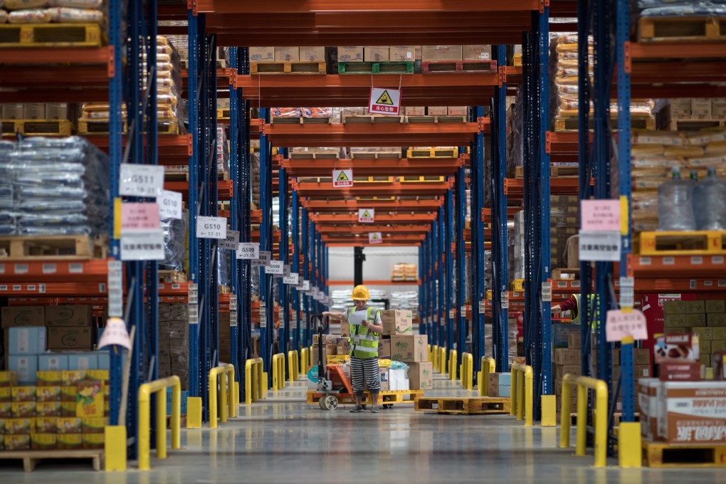 Workers in a Tmall.com warehouse gather orders from customers in Jiangmen, Guangdong province. E-commerce platforms are getting busier as Chinese consumers start to spend in a big way again as the coronavirus pandemic abates at home. Photo: EPA-EFE