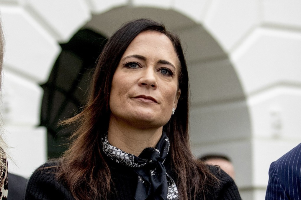 White House press secretary Stephanie Grisham listens as President Donald Trump speaks to the media on the South Lawn of the White House in October. Photo: AP