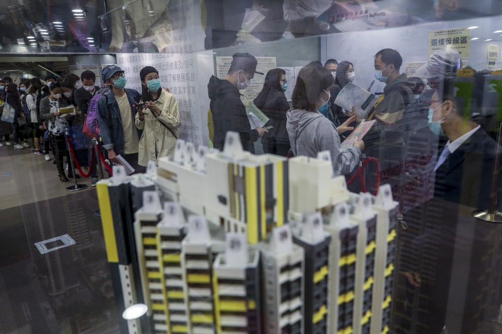 Potential homebuyers wearing protective face masks queue up at the Housing Authority’s customer service centre in Lok Fu for Home Ownership Scheme flats, on March 2. Photo: Winson Wong