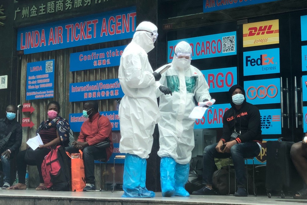 Epidemic prevention personnel carry out checks in Guangzhou on Tuesday. Photo: Weibo