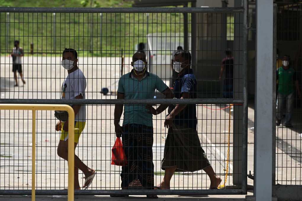 Migrant workers in Singapore are living in fear following a surge of coronavirus infections in their dormitories, where they say cramped and filthy conditions make social distancing impossible. Photo: AFP