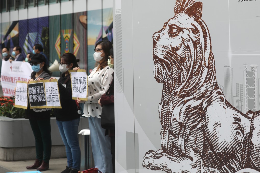 Small investors protest outside the HSBC headquarters in Hong Kong’s Central district on April 8. HSBC was among big banks that cancelled dividend payouts and suspended buy-backs on April 1 after a request from UK regulators in light of the coronavirus pandemic. Photo: Dickson Lee