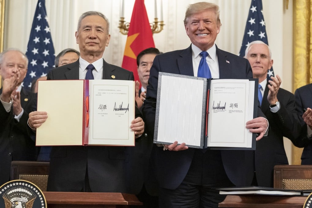 Chinese Vice-Premier Liu He and US President Donald Trump at the January 15 signing ceremony for the phase-one trade deal. Analysts say one way to increase US-China cooperation on the pandemic would be to roll back tariffs that still exist on Chinese exports. Photo: Shealah Craighead/White House via dpa