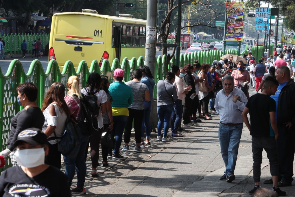 Sex workers line up to collect a bank card to help with the closure of hotels in Mexico City. Photo: EPA-EFE