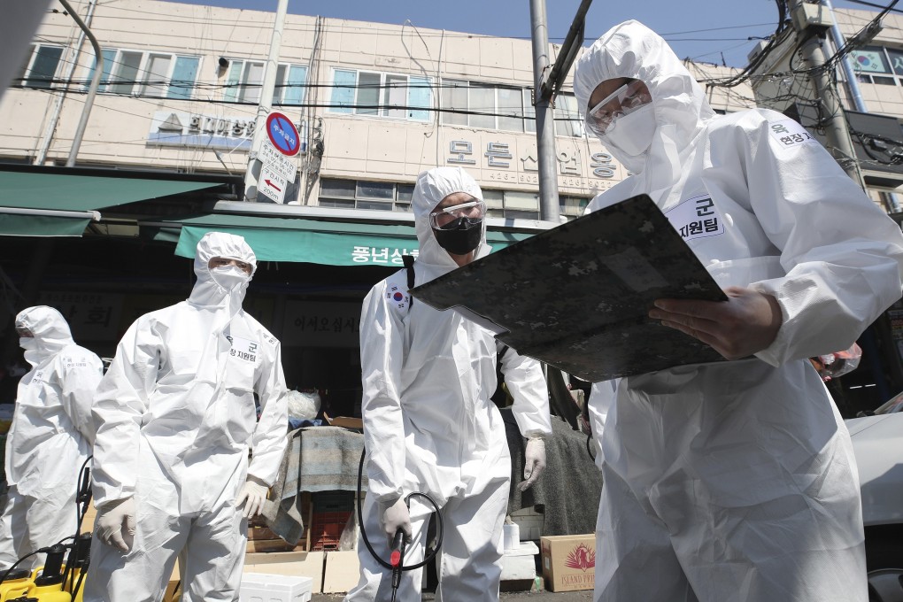 Soldiers prepare to disinfect a market in Daegu, South Korea, on April 8, 2020. Photo: Yonhap via AP