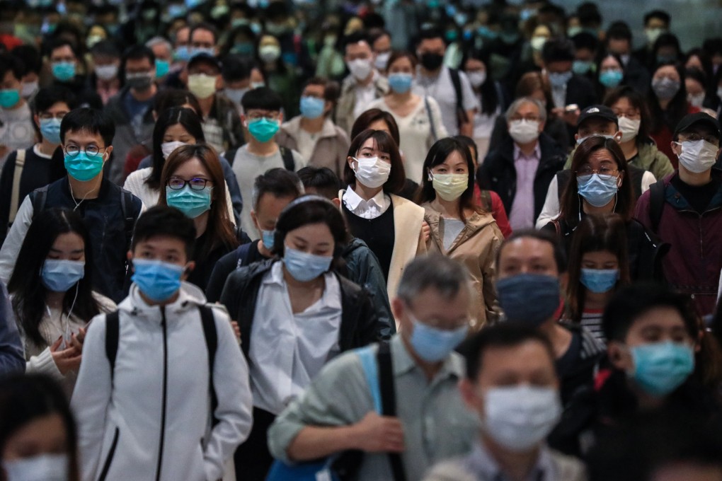 Hong Kong commuters in masks, going to work in Central. Photo: May Tse