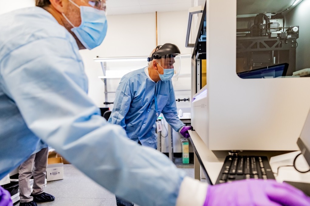 Amazon employees begin assembling the equipment needed for its first coronavirus testing lab. Photo: AFP