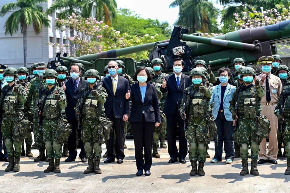 Taiwan President Tsai Ing-wen (centre) visits a military base on Thursday, as her government unveiled measures to relieve the economic impact of the pandemic. Photo: AFP