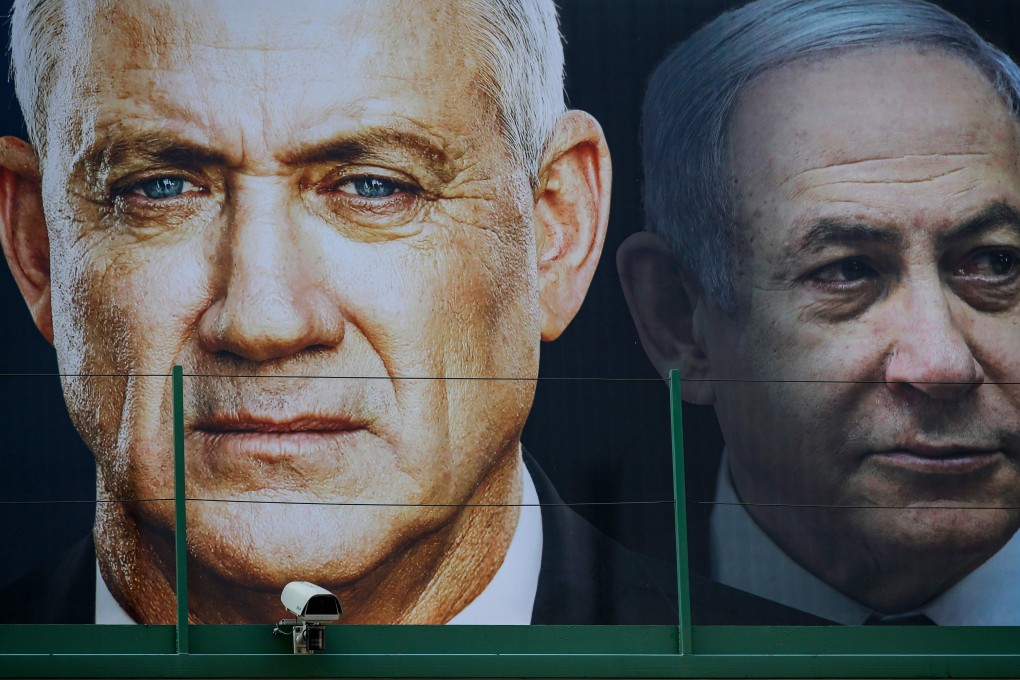 An election banner for the Israeli Blue and White political alliance with the face of its leader retired army general Benny Gantz and Prime Minister Benjamin Netanyahu. Photo: AFP