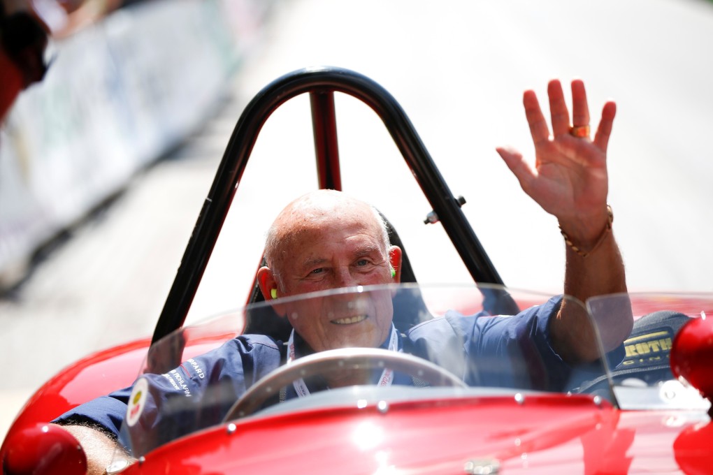 Former Formula One driver Stirling Moss waves to spectators as he sits in his 1955 Ferrari 750 Monza during the Ennstal Classic rally near the Austrian village of Groebming in this July 20, 2013. Photo: Reuters