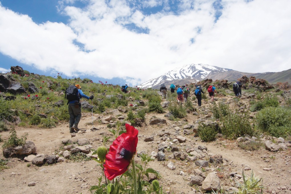 Hiking in the mountains of Iran, with Mount Damavand in the background. Photo: Farzin Malaki
