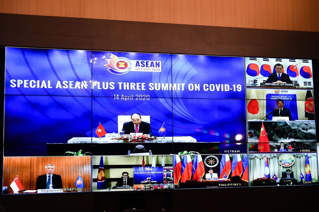 Multiple screens of a live video conference for Asean Plus Three special summit on the Covid-19 pandemic. Photo: AFP