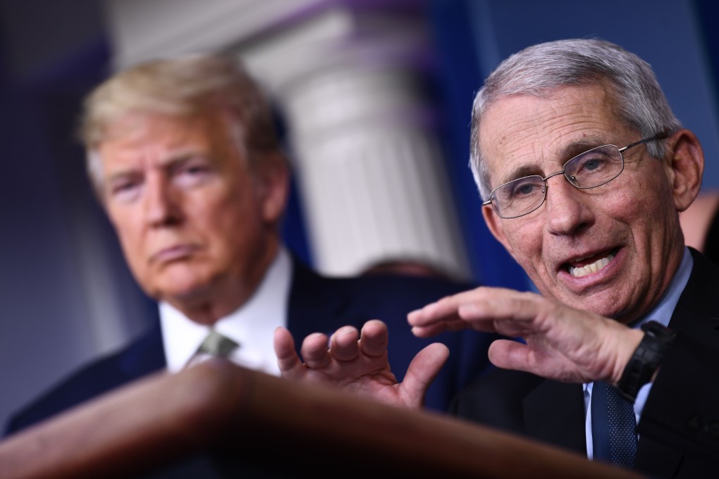 Dr Anthony Fauci speaks as US President Donald Trump listens during a coronavirus press briefing at the White House in March. Photo: AFP