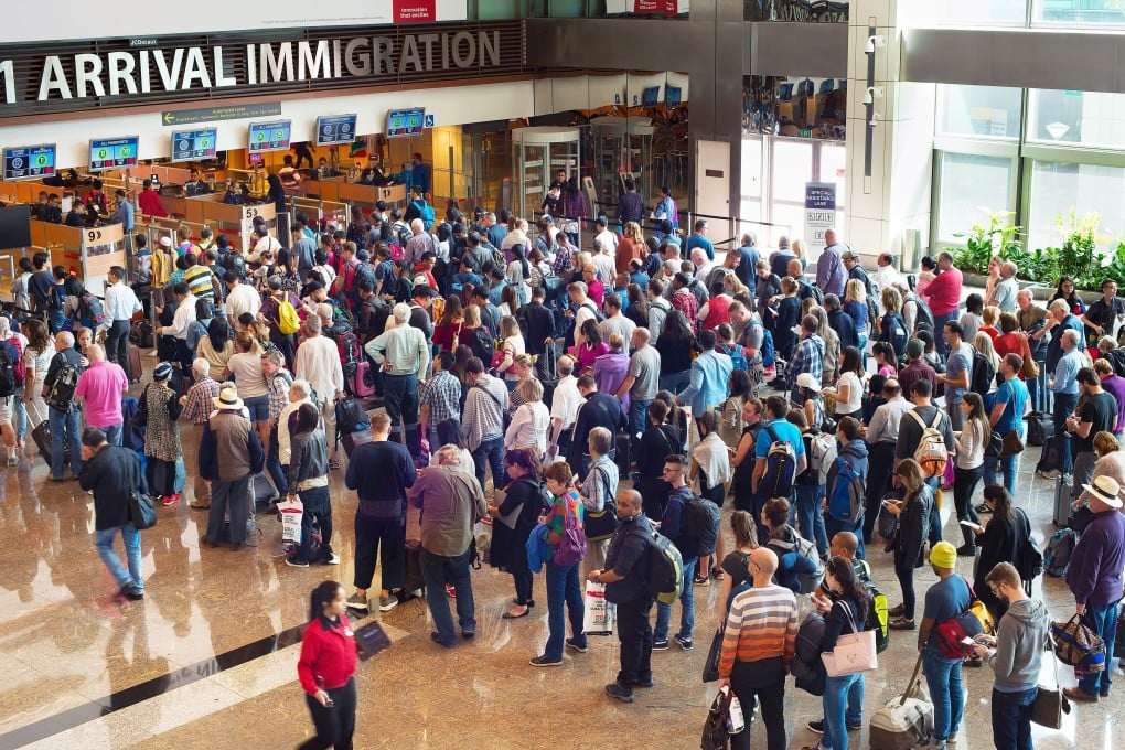 Waiting in long queues for passport control is something we don't miss about travel. Photo: Shutterstock