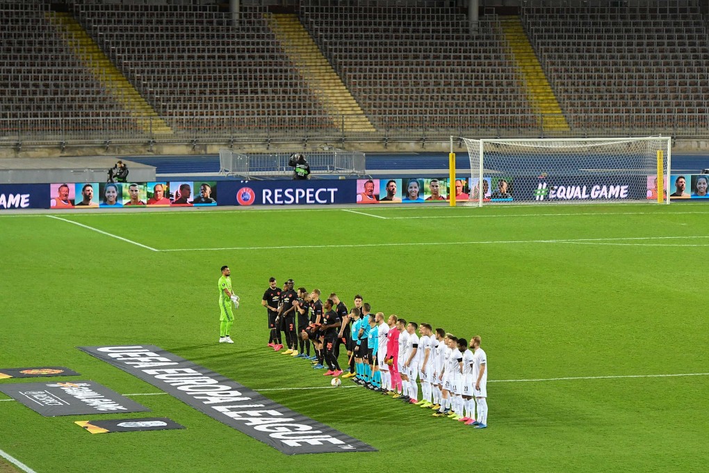 Players of LASK and Manchester United line up before their Uefa Europa League match, which was held behind closed doors because of the Covid-19 pandemic. Photo: AFP
