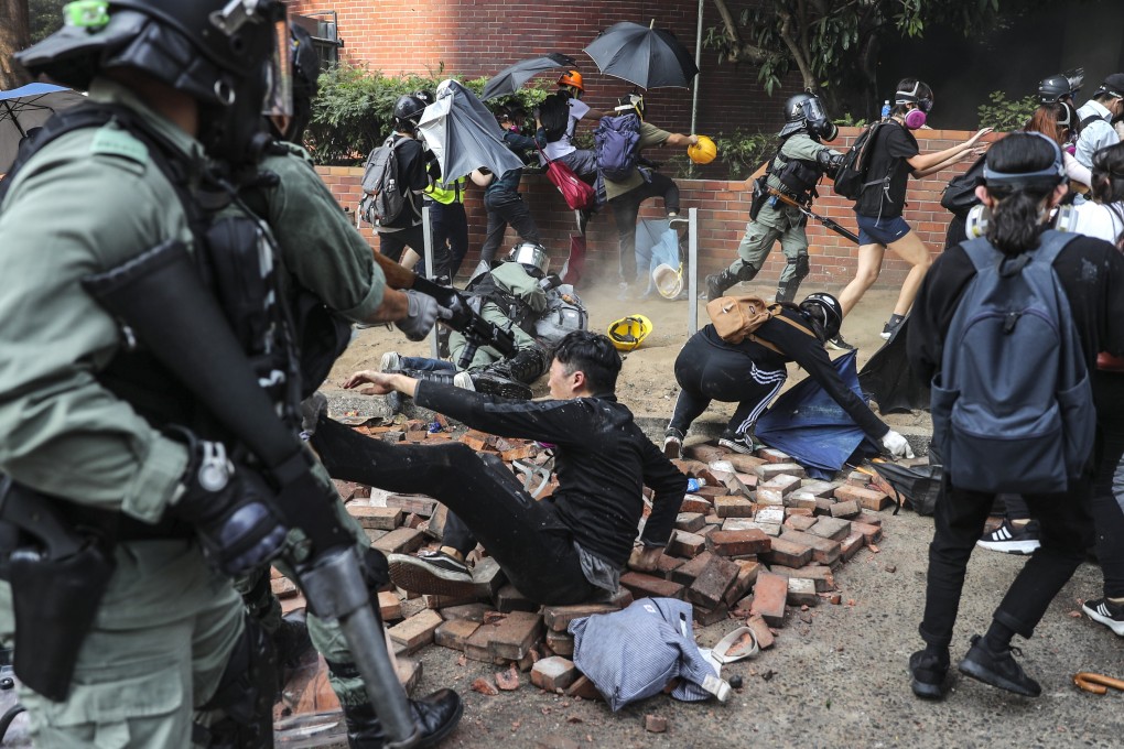 Riot police confront anti-government protesters at Polytechnic University in November. Photo: Sam Tsang