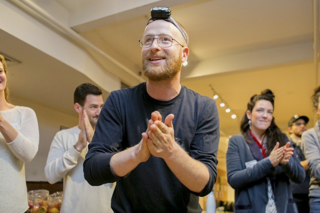 Caveday co-founder Jeremy Redleaf leads a group session before everyone gets down to work – without their phones. Photo: Caveday