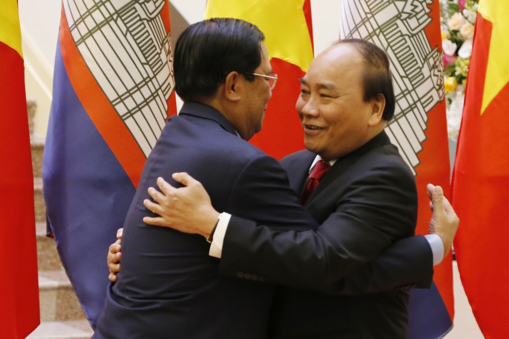Cambodian Prime Minister Hun Sen (left) greets Vietnam’s Nguyen Xuan Phuc ahead of talks in Hanoi. As a major power rivalry re-emerges, the neighbouring countries may find themselves in opposing camps. Photo: AP