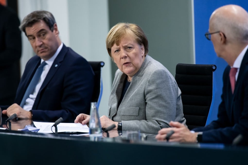 (From left) Markus Soeder, Minister President of Bavaria; German Chancellor Angela Merkel; and Peter Tschentscher, First Mayor of Hamburg, hold a press conference at the chancellery in Berlin on Wednesday. Photo: dpa