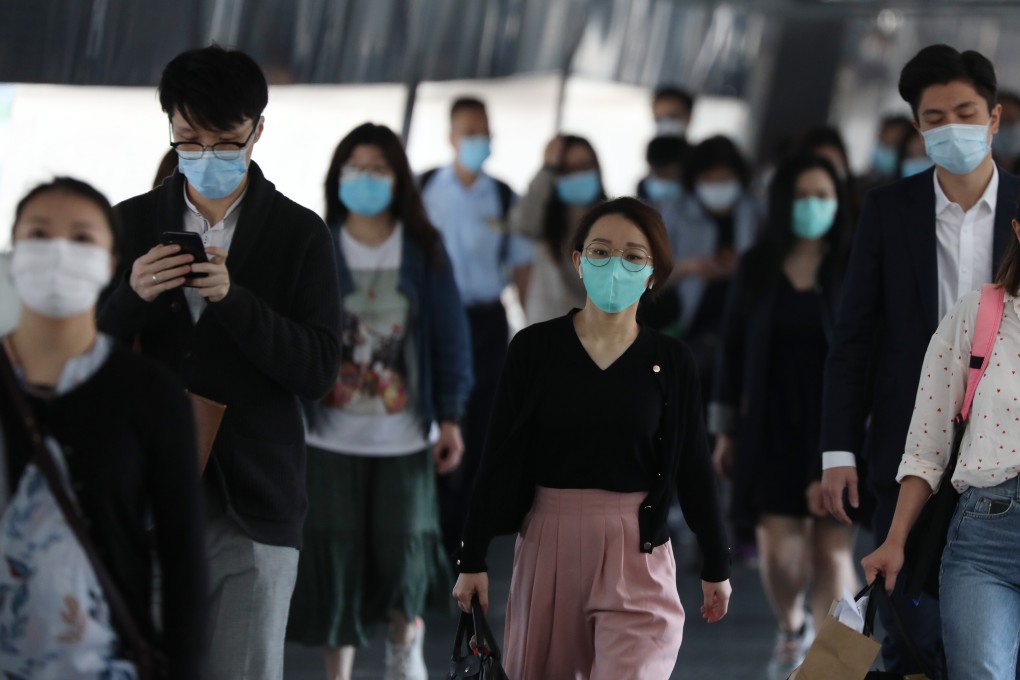 Office workers in face masks going to work in Central amid the coronavirus outbreak. Photo: Nora Tam