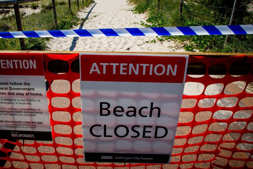 A closed beach sign at Coolangatta Beach near the Queensland-New South Wales border. Photo: AFP