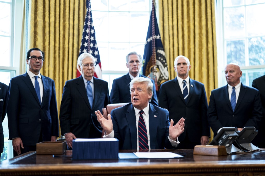 US President Donald Trump speaks before signing the Coronavirus Aid, Relief, and Economic Security (Cares) Act, in the Oval Office of the White House in Washington on March 27. The US$2 trillion stimulus package is the largest in US history. Photo: Bloomberg