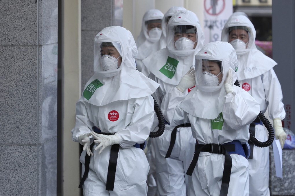 Health care workers arrive for duty at Dongsan Medical Centre in Daegu, South Korea. The city has seen a number of cases of recovered coronavirus patients testing positive again. Photo: AP