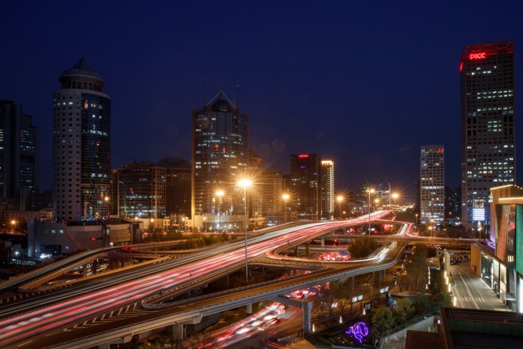 Cars jam a major thoroughfare at evening rush hour in the Central Business District in Beijing, China, April 7, 2020. Picture taken with a slow shutter speed. REUTERS/Thomas Peter