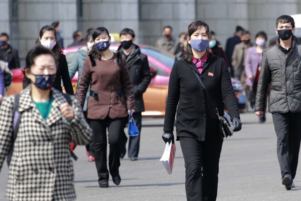 Pedestrians seen in face masks in Pyongyang on April 1, 2020. Photo: AP