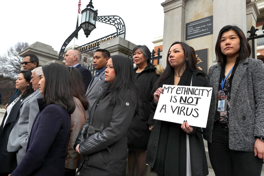 Members of the Asian-American Commission protest racism towards the Asian American community sparked by the coronavirus outside the Massachusetts State House in Boston on March 12, 2020. Photo: Getty Images