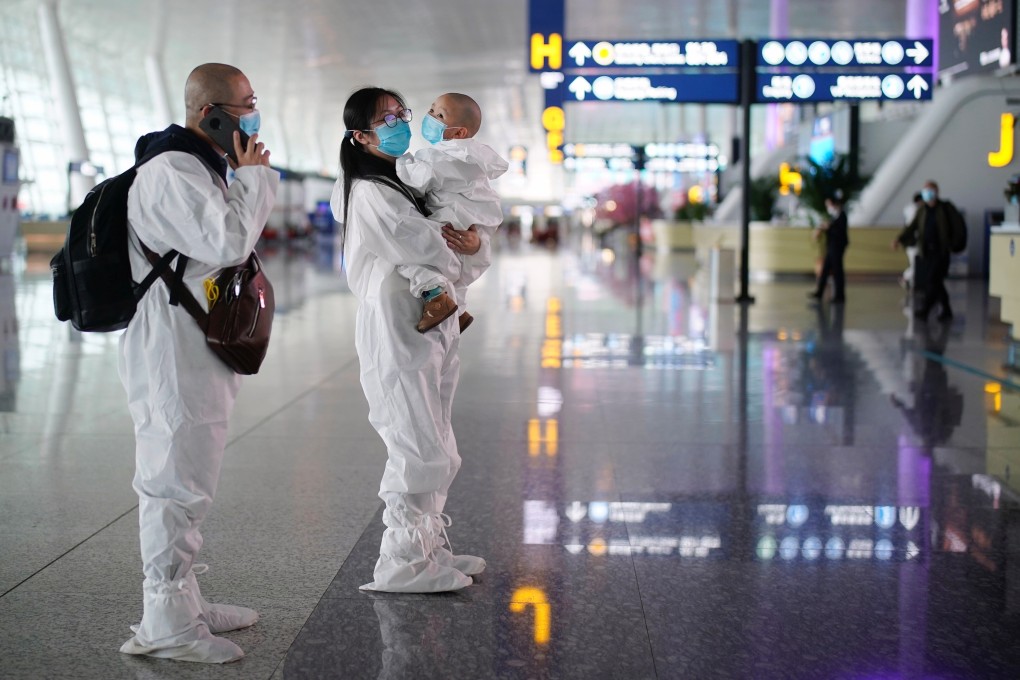 A family wears protective suits at Wuhan Tianhe International Airport on April 10, after the city’s lockdown was lifted. Photo: Reuters