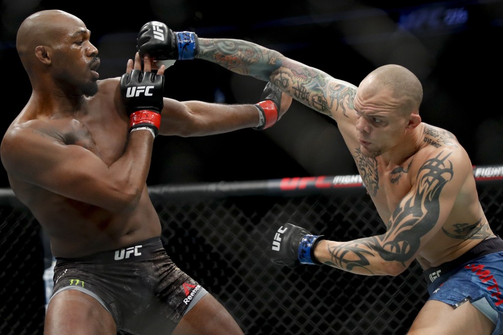 Jon Jones fights Anthony Smith in their light heavyweight title bout at UFC 235. Photos: AP