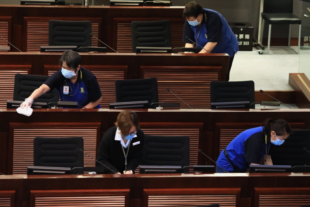 Workers disinfecting the Legco main chamber amid the coronavirus outbreak, Legislative Council Complex, Tamar. Photo: May Tse