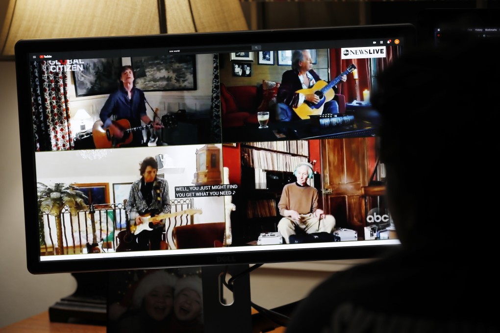 A college student watches the The Rolling Stones perform. Photo: EPA