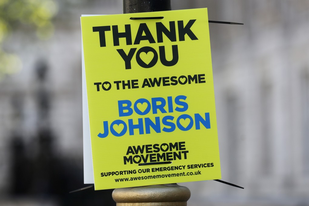 A sign thanking British Prime Minister Boris Johnson on a lamp post in London. Photo: Reuters