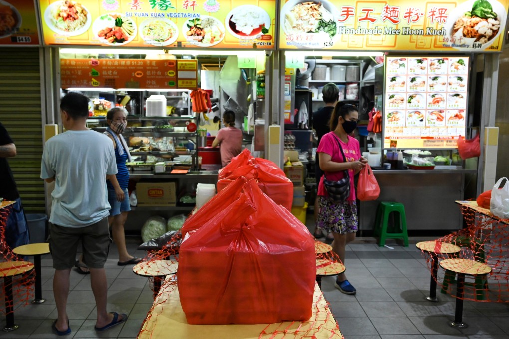 Packed lunch boxes at a hawker centre in Singapore. Photo: AFP