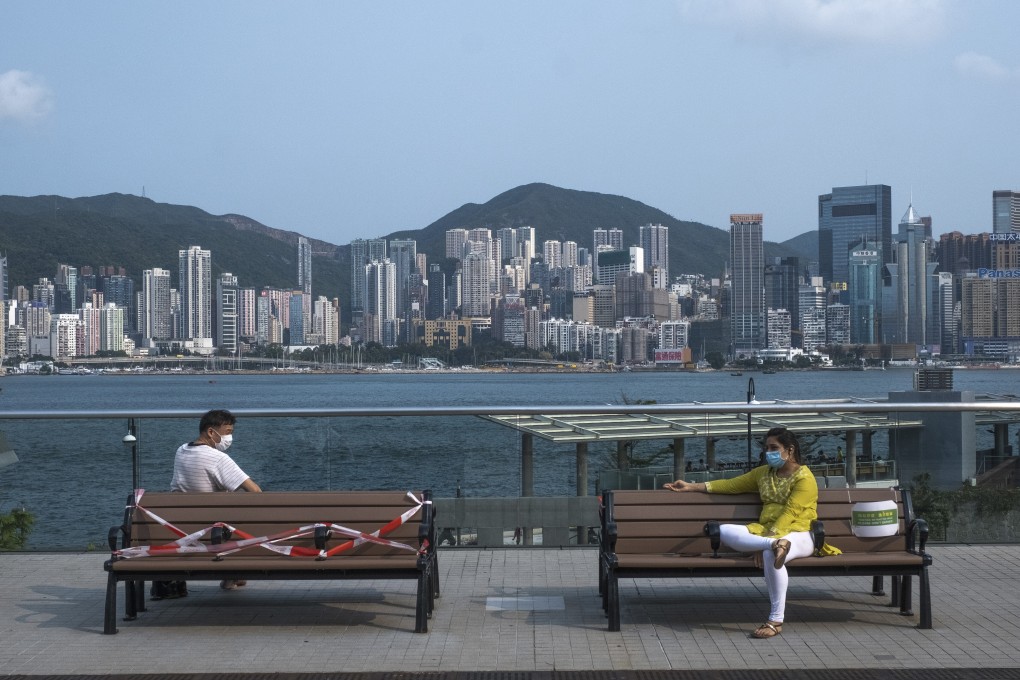 People seated apart at the Tsim Sha Tsui promenade. Photo: Sun Yeung