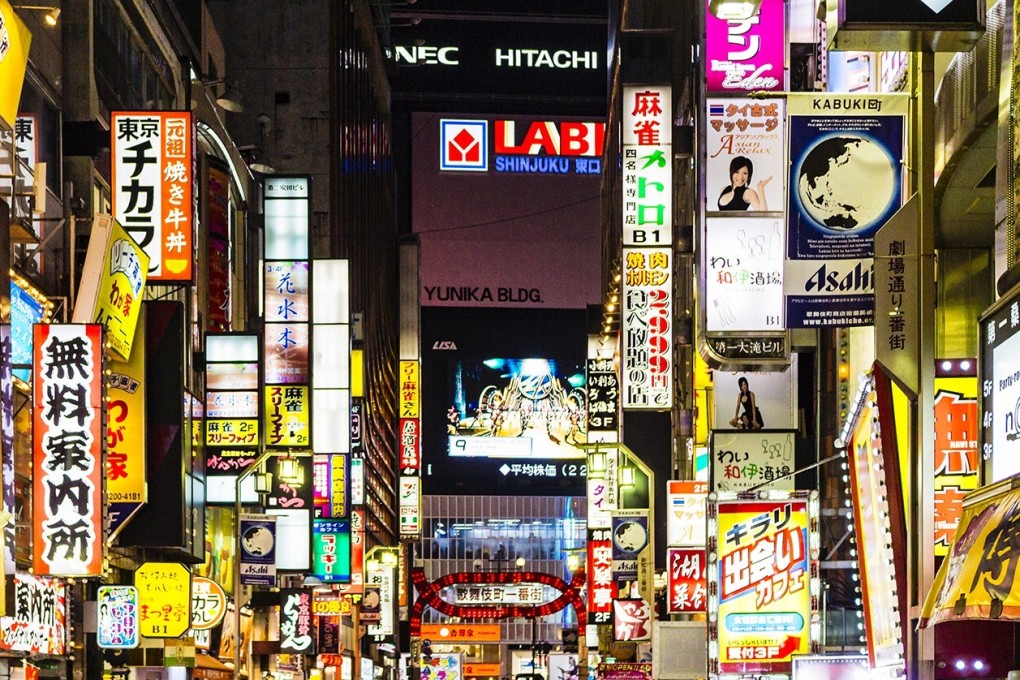 Neon signs in Tokyo’s Kabukicho entertainment and red light district. Photo: Getty Images/iStockphoto