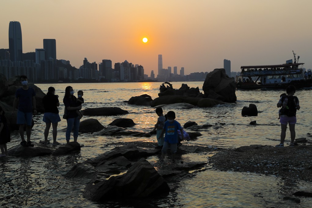 Families take in the sunset from Hong Kong’s Lei Yue Mun. Photo: Edmond So