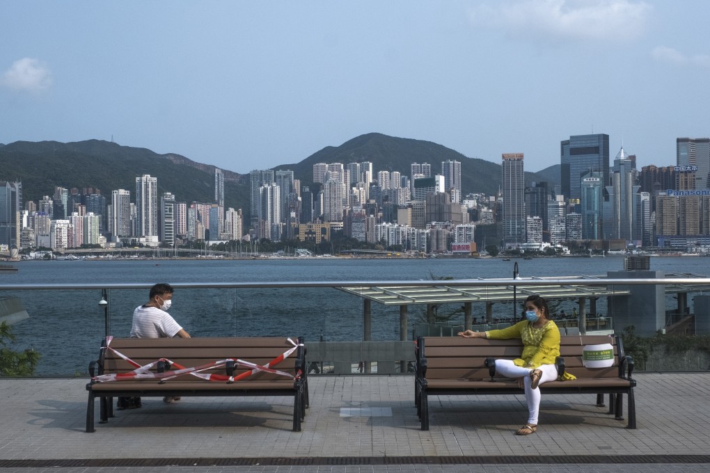People sit apart at the Tsim Sha Tsui waterfront on April 17. Hongkongers have been diligent about wearing face masks, maintaining social distance and practising good hygiene during the coronavirus outbreak in the city. Photo: Sun Yeung