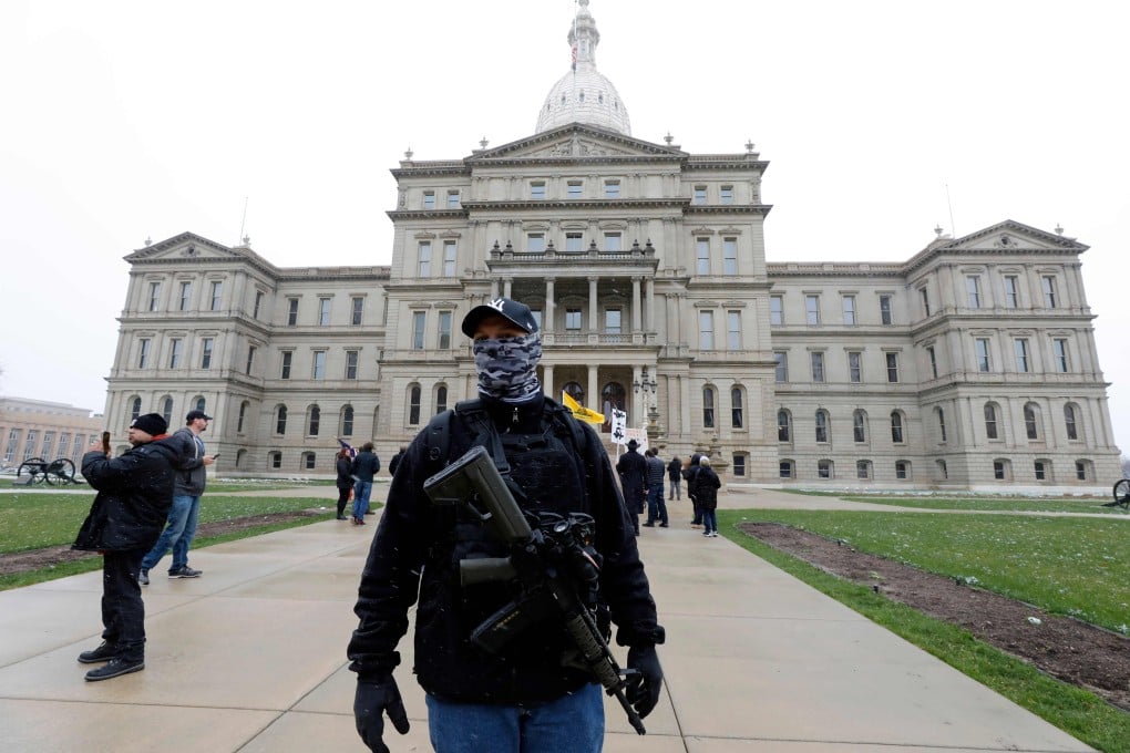 People protest against “excessive quarantine” at the Michigan State Capitol on April 15. Photo: AFP