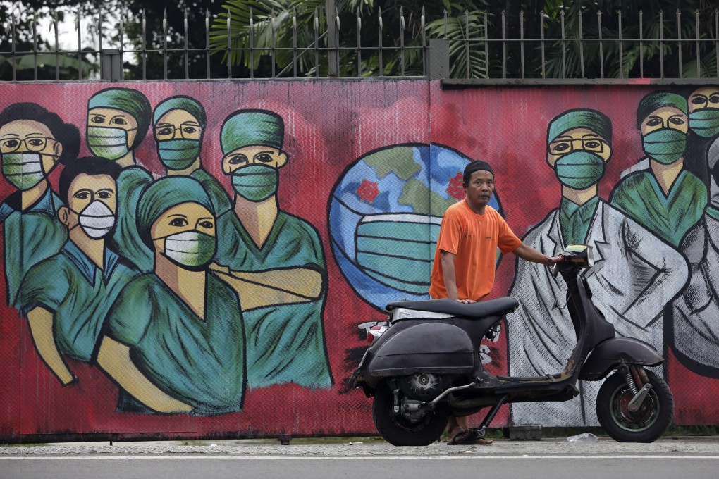 A coronavirus mural in Depok, on the outskirts of Jakarta, Indonesia. Photo: AP