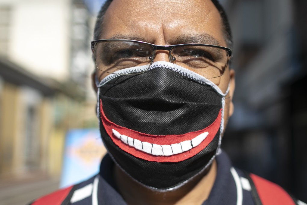 A man wears a face mask in Caracas, Venezuela. People with glasses know that masks cause the lenses to fog up with every breath. Photo: AP
